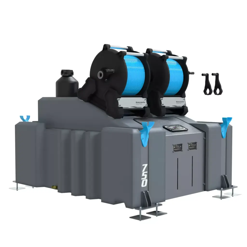 A large grey 2 Man 750L WFP System (DI) with two blue manual hose reels on top, multiple access panels, blue hooks, support feet at each corner, and "750" visible on the front corner.