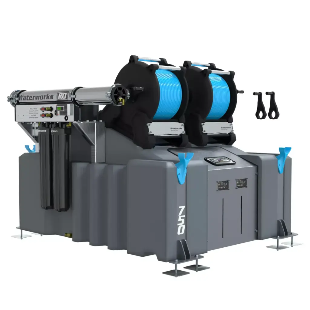 The 2 Man 750L Window Cleaning System (RO) with Manual Reels is a large industrial grey and blue machine featuring control panels, stabilising feet, and reels of blue cable, plus black hoses and handles mounted on the side.